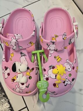 CROCS Pink Kids' Sandals with Snoopy & Woodstock Accents